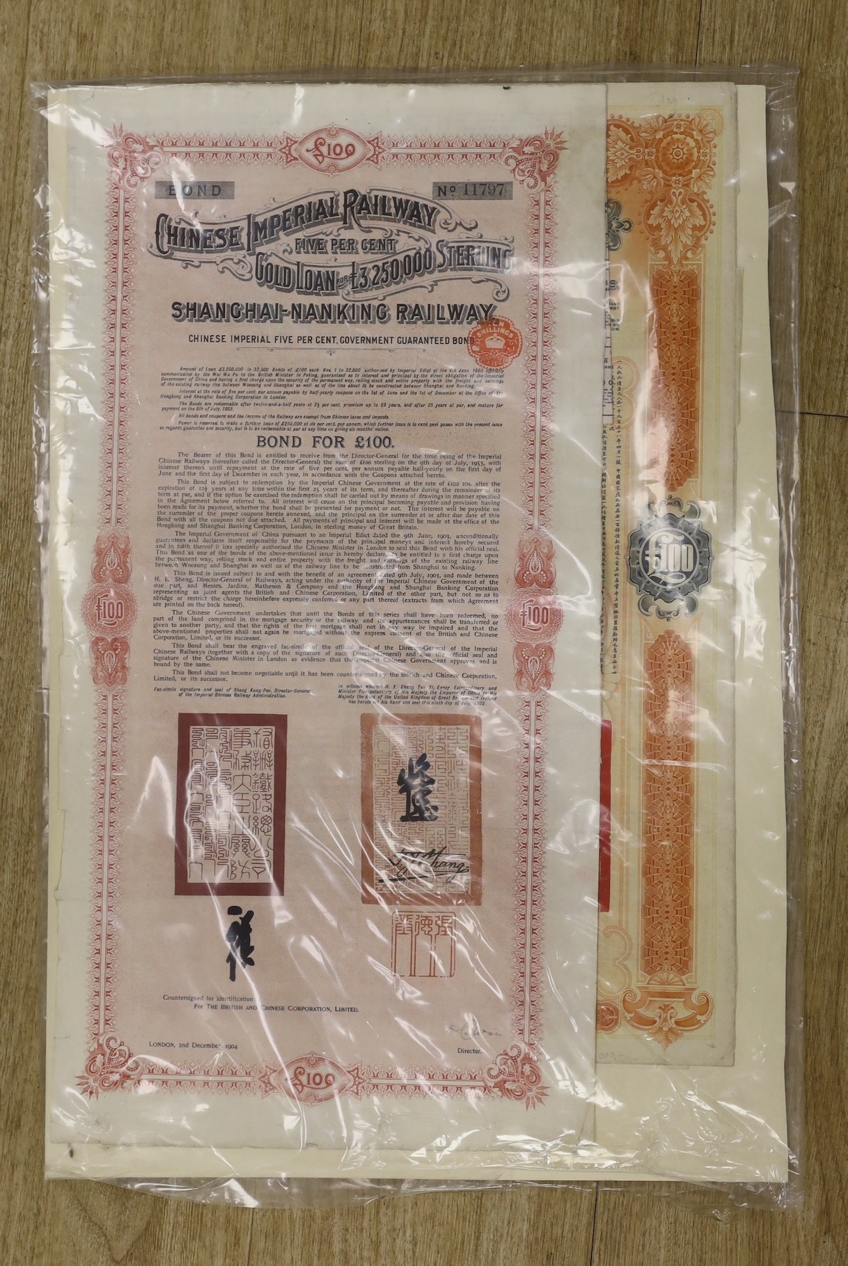 Chinese imperial bonds, including Imperial Chinese government £20 railways sinking fund gold loan of 1911, framed Chinese Imperial Railway 5% government guaranteed bond 1904, some coupons attached and Railway loan bond f